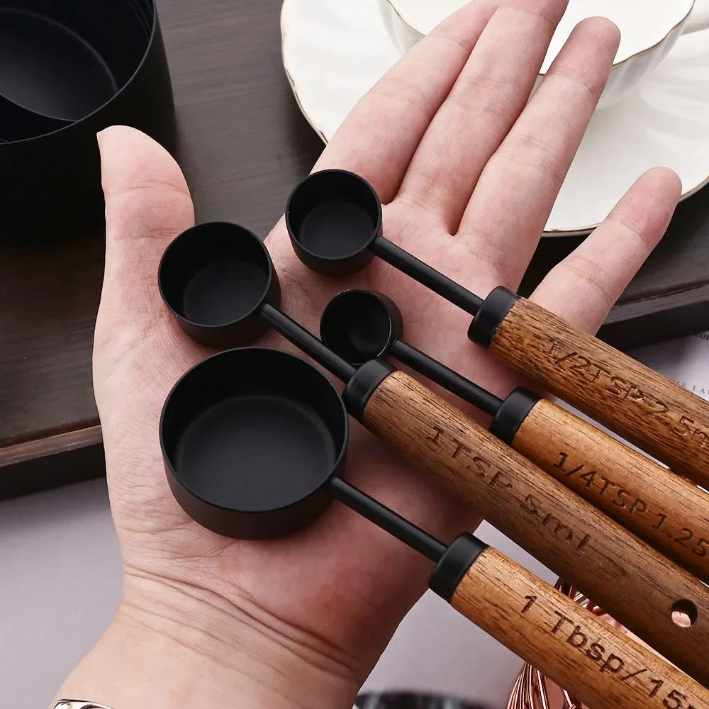 Stylish Lydia Measuring Cup & Spoon Set with wooden handles and stainless steel in black or gold, 8-piece set with engraved sizes for precise measurements, perfect for home décor enthusiasts and functional kitchen style.