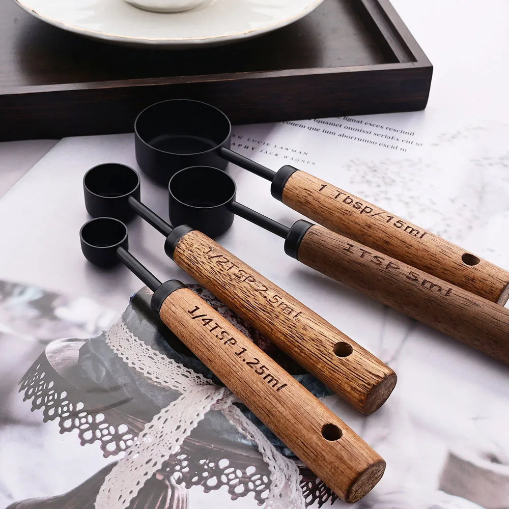 Stylish Lydia Measuring Cup & Spoon Set with wooden handles and stainless steel in black or gold, 8-piece set with engraved sizes for precise measurements, perfect for home décor enthusiasts and functional kitchen style.