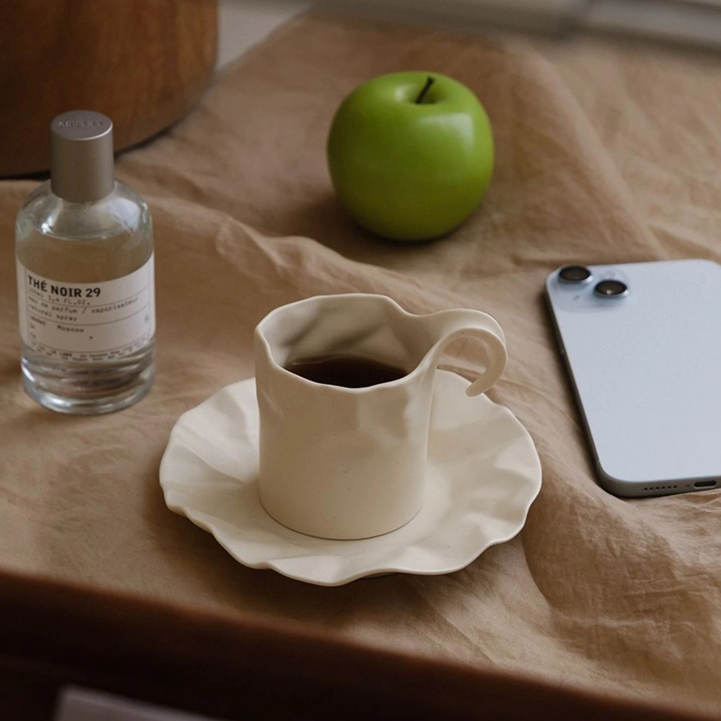 Gochi Mug & Saucer – elegantly crafted ceramic set with a unique paper-like texture and soft cream hue, perfect for adding artistry to your coffee or tea ritual.