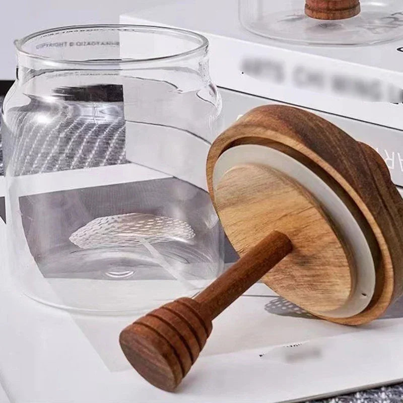 Fivel Honey Jar – elegant high borosilicate glass jar with a sealed storage design, wooden lid, and dip stick, perfect for keeping honey fresh and stylishly serving it.