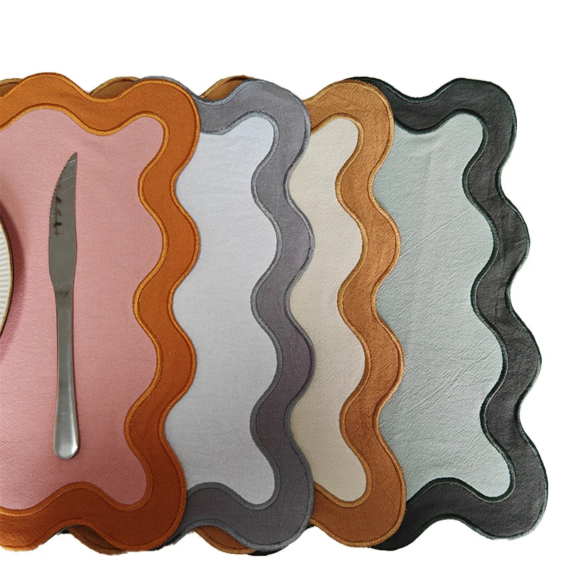 Image of the Paloma Placemat featuring a rectangular shape with a charming scalloped edge, designed for home décor enthusiasts. Made from a durable cotton double layer, it measures 35 x 50 cm and is available in four stylish colorways. Ideal for decorating dining tables with elegance and sophistication.