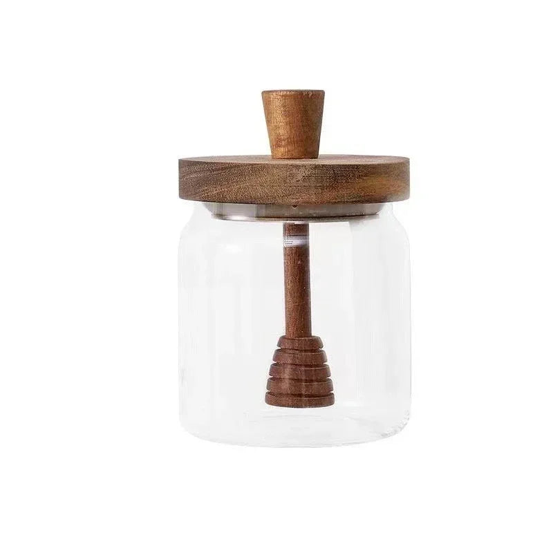 Fivel Honey Jar – elegant high borosilicate glass jar with a sealed storage design, wooden lid, and dip stick, perfect for keeping honey fresh and stylishly serving it.