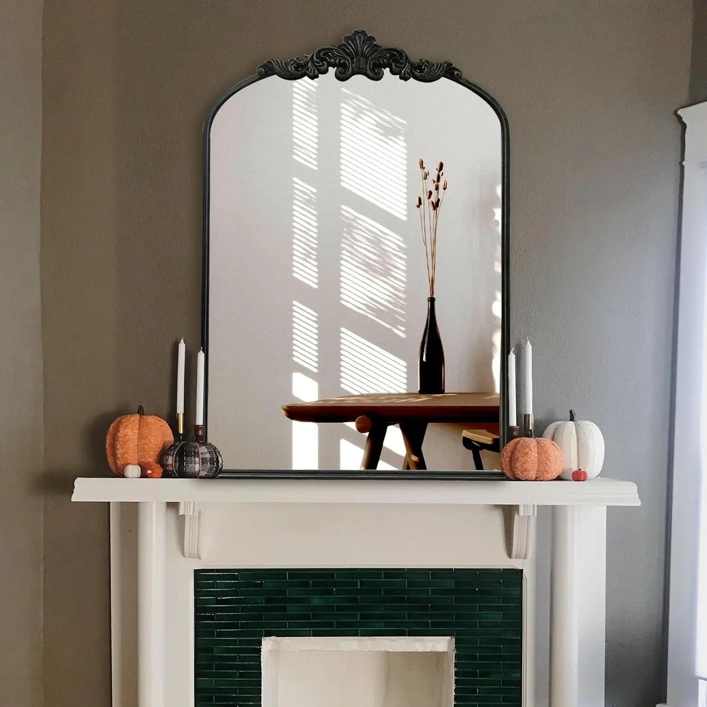Addison Mirror featuring a vintage-inspired arched design with a sturdy black or brass iron frame. This elegant mirror is perfect for home décor enthusiasts, adding a touch of classic charm and sophistication to any room. Ideal for enhancing entryways, living rooms, or bedrooms, it serves both functional and decorative purposes.