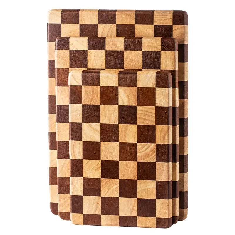 Rectangular wooden cutting board with a checkerboard pattern, available in three sizes. Features rounded corners and non-slip rubber feet, used for both meal prep and serving as a cheese board or decorative kitchen display.
