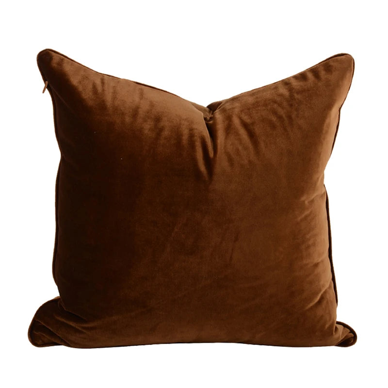 A collection of Bernadette Pillow Covers in various sizes and deep jewel tones, each crafted with a luxurious velvet feel. Made from 100% polyester, these pillow covers offer a rich and sophisticated look, perfect for home décor enthusiasts. Displayed on a sofa, the covers showcase their vibrant colorways and soft texture, ideal for adding elegance and comfort to any room. Pillow inserts are not included, allowing for customizable use and styling.