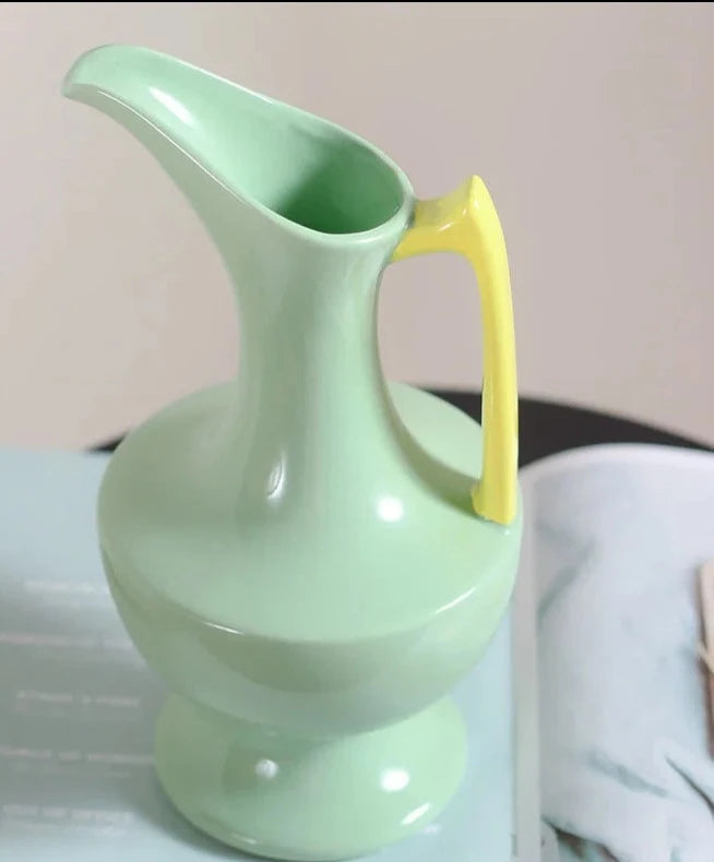 Colorful ceramic vase for floral display, bright décor accent.