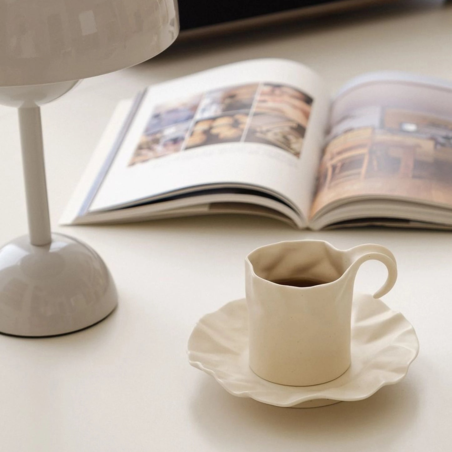 Gochi Mug & Saucer – elegantly crafted ceramic set with a unique paper-like texture and soft cream hue, perfect for adding artistry to your coffee or tea ritual.