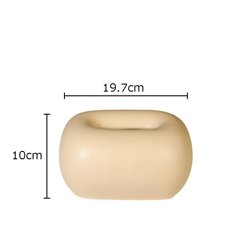 Rounded ceramic tissue box in a modern, minimalist design with four colorway options. A sleek and stylish home décor piece, perfect for living rooms, bedrooms, offices, or bathrooms.