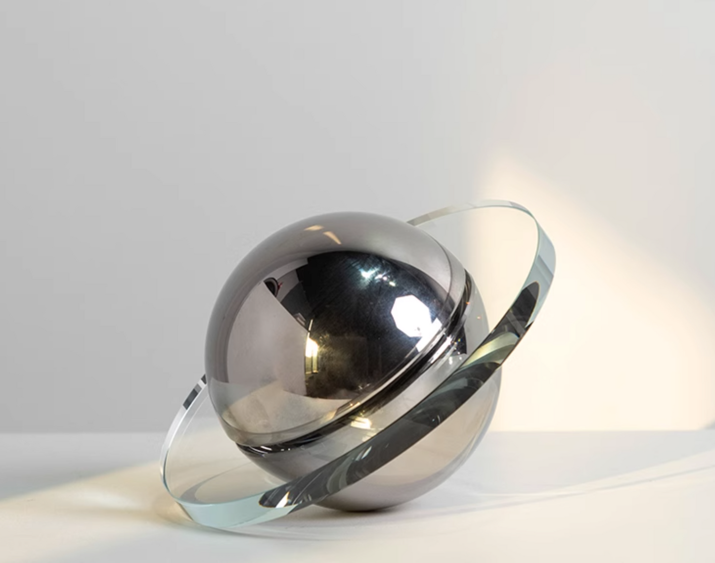 Modern crystal Flying Saucer Decorative Object in silver or brown finish. A captivating blend of contemporary design and cosmic inspiration, ideal for adding a unique touch to your space.