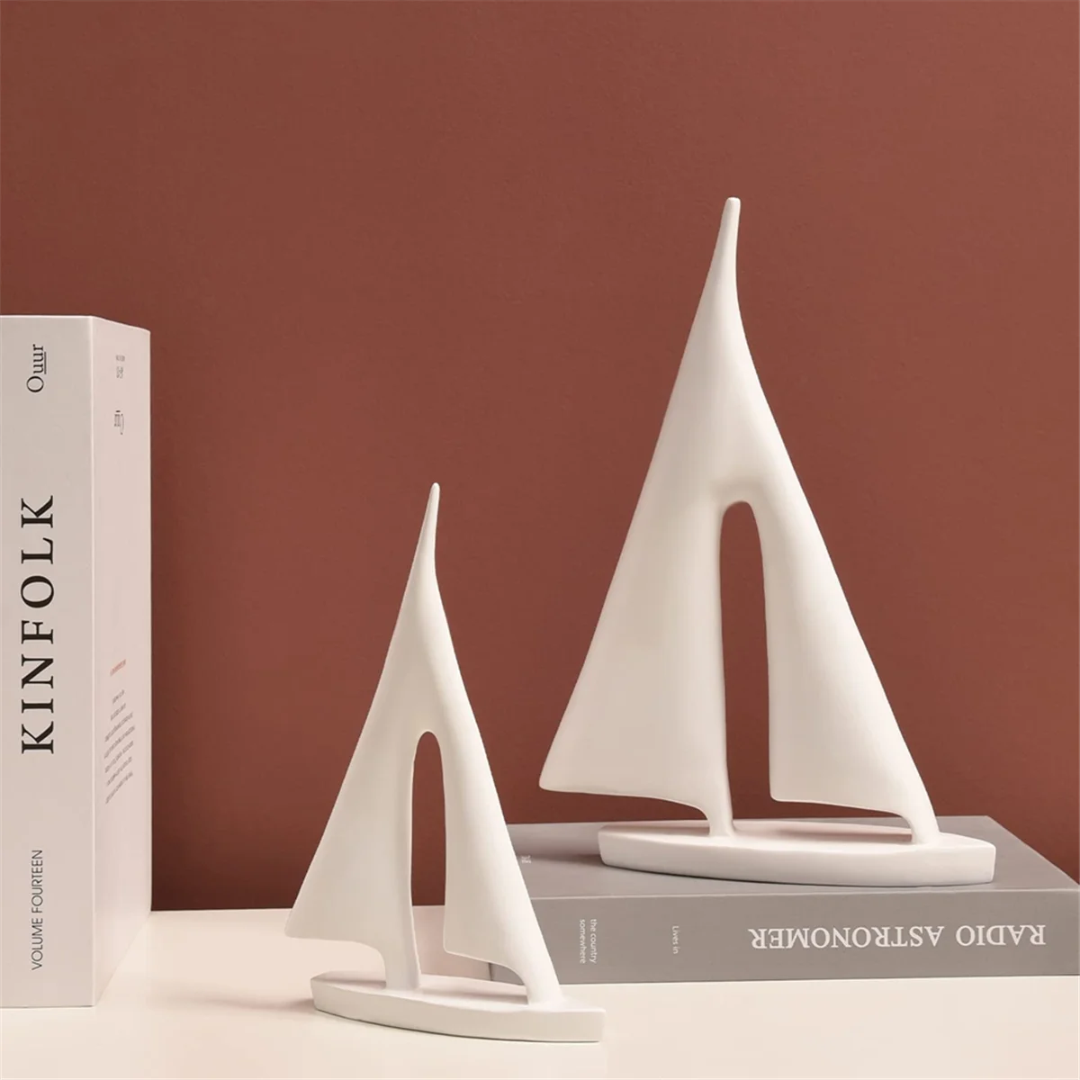 Zaz Sailboat Decorative Object – set of two white resin sailboats in small and large sizes, featuring a modern minimalist design, perfect for coastal-inspired décor.