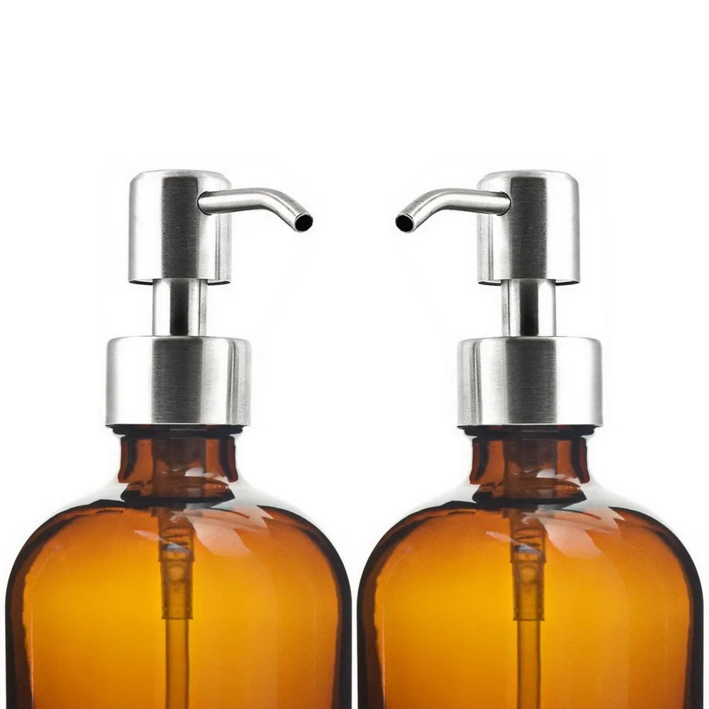 A set of two amber glass soap dispensers, each with a 16 oz capacity, featuring a choice of silver or black stainless steel pumps. Includes six printed labels for easy identification. Ideal for home décor enthusiasts, this reusable and refillable set adds a stylish touch to kitchens and bathrooms.