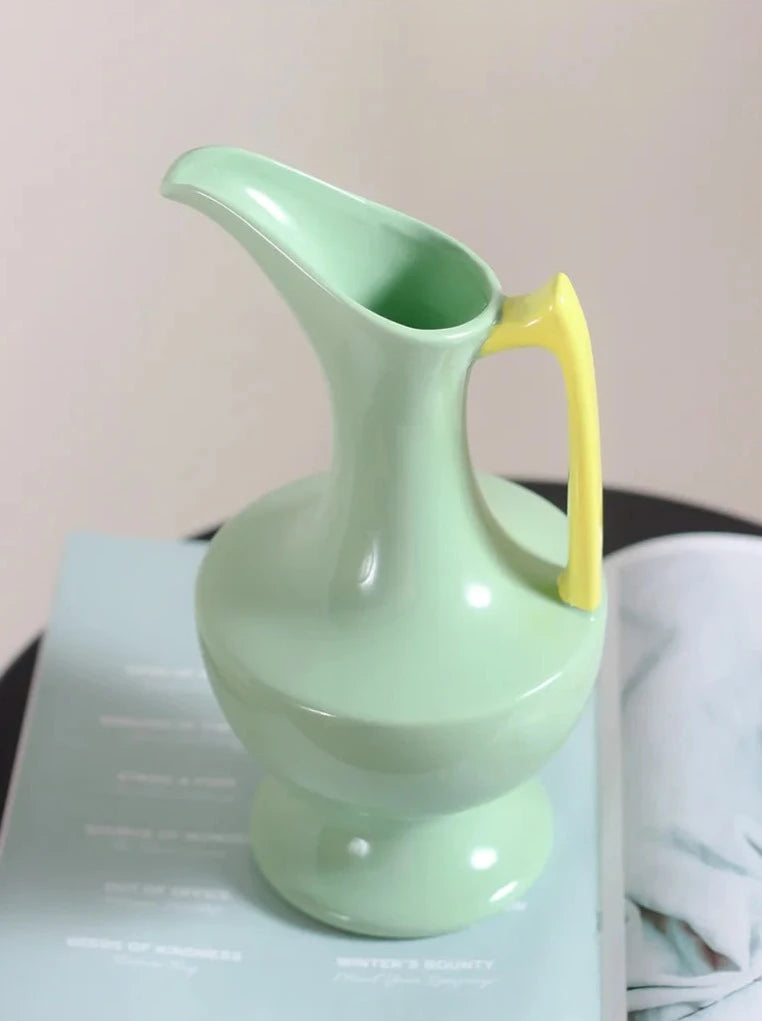 Colorful ceramic vase for floral display, bright décor accent.