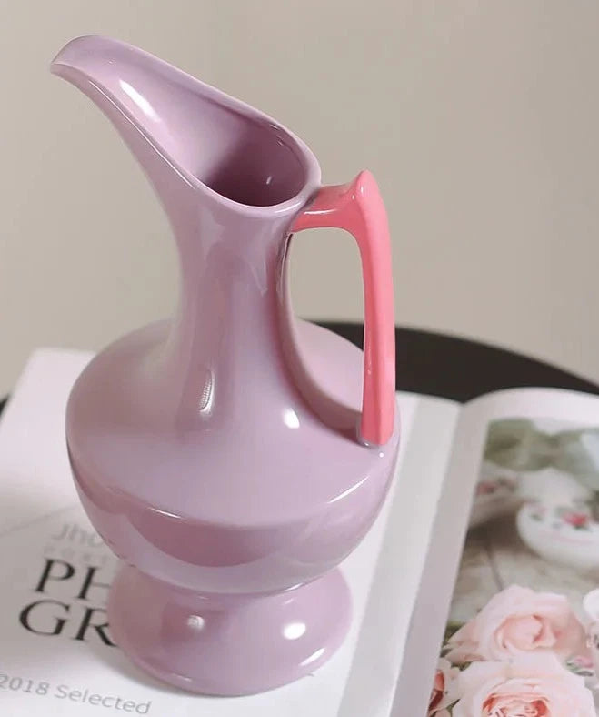 Colorful ceramic vase for floral display, bright décor accent.