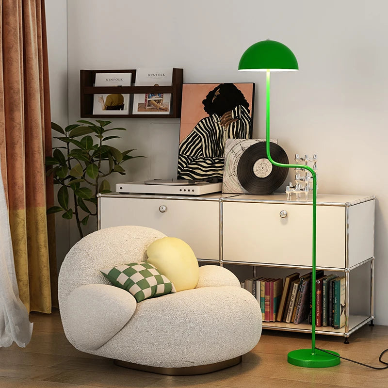 Image of the Tully Floor Lamp featuring a sleek, modern design with bright colorways. The lamp has a unique mushroom shape, made from durable metal, and includes an easy-to-use button switch. Perfect for home décor enthusiasts looking to add stylish accent lighting to their space.