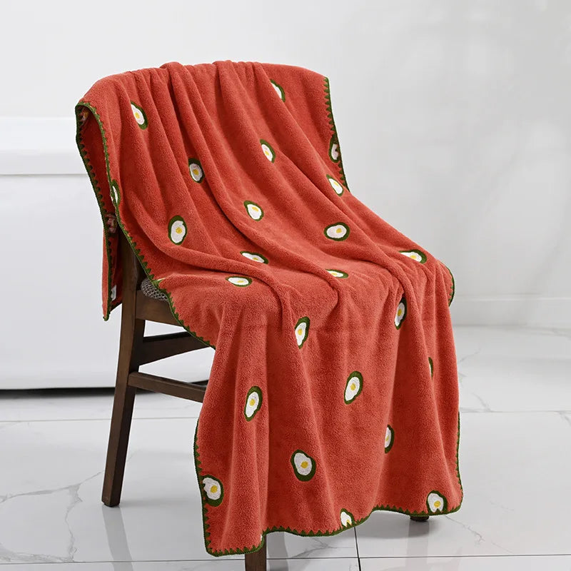 Effie Towel collection: bath and hand towels with embroidered fruit motifs, velvet feel, warm colorways, polyester and combed cotton.