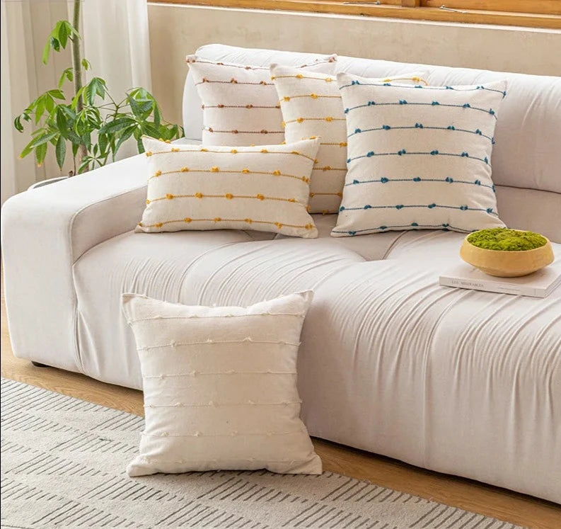 Elegant Irene Pillow Cover with cream neutral base and colored striped detailing, available in two sizes. Made from soft, high-quality cotton. Ideal for home decor enthusiasts, perfect for adding style to living rooms and bedrooms. Does not include filler.