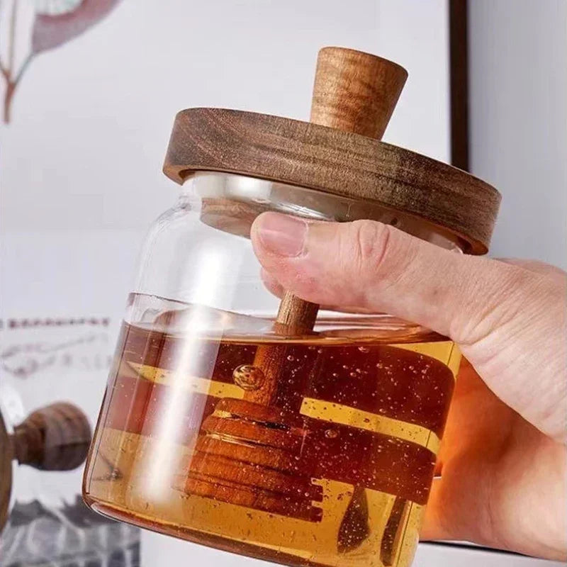 Fivel Honey Jar – elegant high borosilicate glass jar with a sealed storage design, wooden lid, and dip stick, perfect for keeping honey fresh and stylishly serving it.