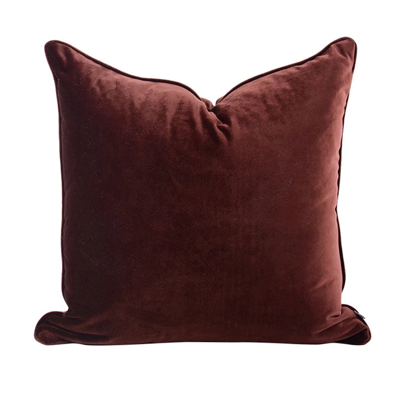 A collection of Bernadette Pillow Covers in various sizes and deep jewel tones, each crafted with a luxurious velvet feel. Made from 100% polyester, these pillow covers offer a rich and sophisticated look, perfect for home décor enthusiasts. Displayed on a sofa, the covers showcase their vibrant colorways and soft texture, ideal for adding elegance and comfort to any room. Pillow inserts are not included, allowing for customizable use and styling.