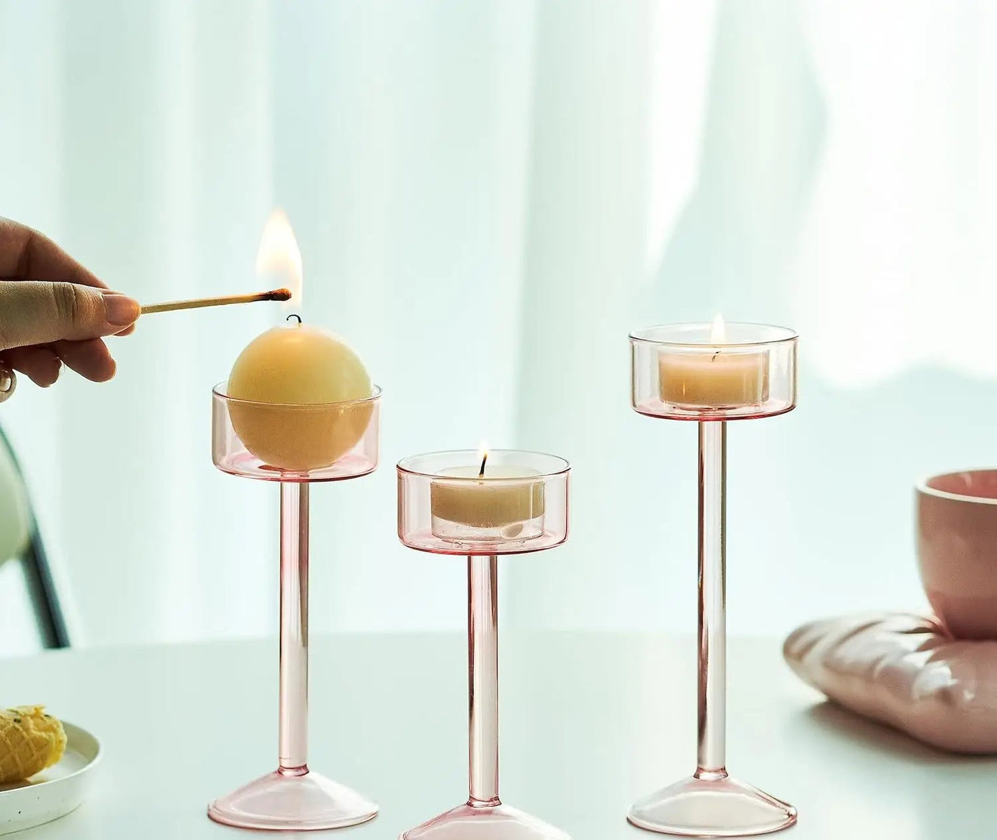 Kiu Candle Holder – set of three modern tea light holders in varying heights and colorways, perfect for creating a sleek, elegant centerpiece on tables, shelves, or mantels.
