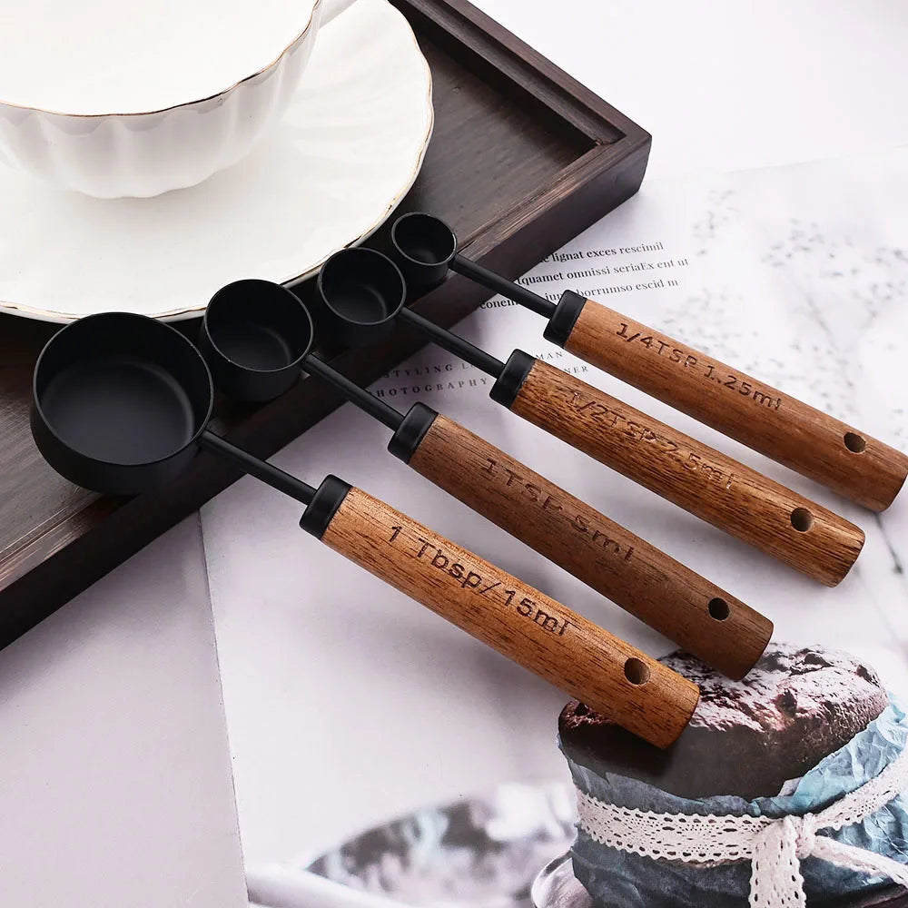 Stylish Lydia Measuring Cup & Spoon Set with wooden handles and stainless steel in black or gold, 8-piece set with engraved sizes for precise measurements, perfect for home décor enthusiasts and functional kitchen style.