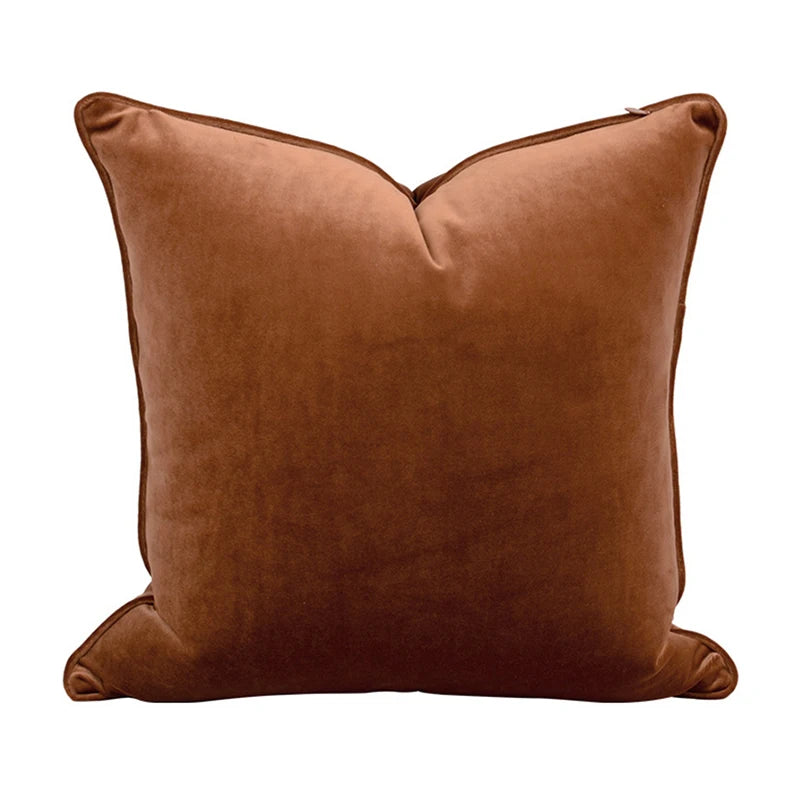 A collection of Bernadette Pillow Covers in various sizes and deep jewel tones, each crafted with a luxurious velvet feel. Made from 100% polyester, these pillow covers offer a rich and sophisticated look, perfect for home décor enthusiasts. Displayed on a sofa, the covers showcase their vibrant colorways and soft texture, ideal for adding elegance and comfort to any room. Pillow inserts are not included, allowing for customizable use and styling.