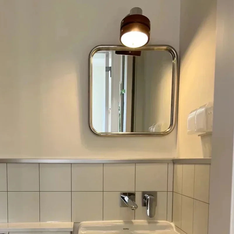 Uri Mirror – square mirror with rounded corners, vibrant colorways, and a retro-inspired design, available in small (60x60 cm) and large (80x80 cm) sizes.