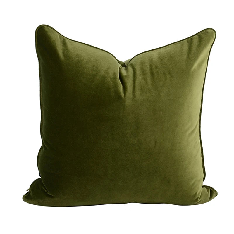 A collection of Bernadette Pillow Covers in various sizes and deep jewel tones, each crafted with a luxurious velvet feel. Made from 100% polyester, these pillow covers offer a rich and sophisticated look, perfect for home décor enthusiasts. Displayed on a sofa, the covers showcase their vibrant colorways and soft texture, ideal for adding elegance and comfort to any room. Pillow inserts are not included, allowing for customizable use and styling.