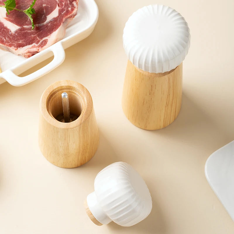 Ugalde Salt & Pepper Mill – elegant rubberwood and ceramic mills in white or indigo, featuring adjustable coarse and fine grinding, available in two sizes for a stylish kitchen upgrade.