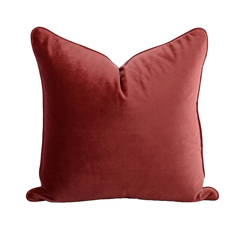 A collection of Bernadette Pillow Covers in various sizes and deep jewel tones, each crafted with a luxurious velvet feel. Made from 100% polyester, these pillow covers offer a rich and sophisticated look, perfect for home décor enthusiasts. Displayed on a sofa, the covers showcase their vibrant colorways and soft texture, ideal for adding elegance and comfort to any room. Pillow inserts are not included, allowing for customizable use and styling.