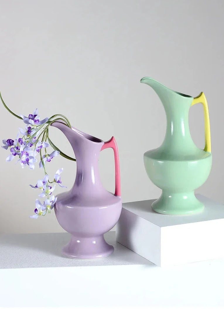 Colorful ceramic vase for floral display, bright décor accent.