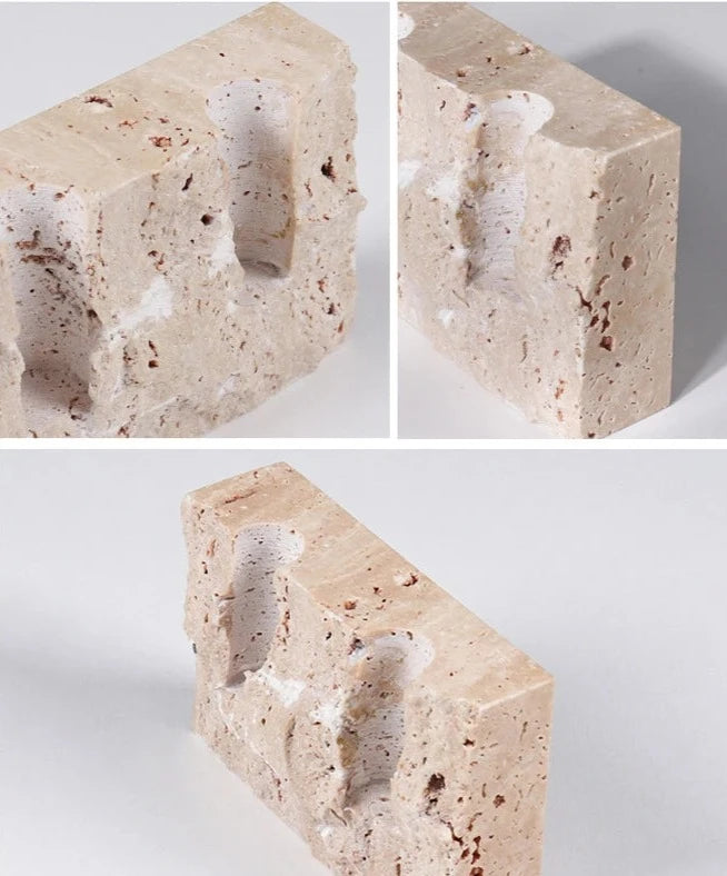 Brutalist candle holder with marble or travertine, anti-slip padding for stability.