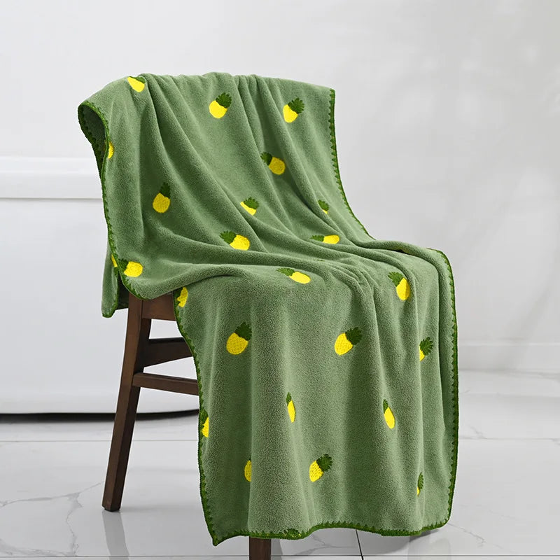 Effie Towel collection: bath and hand towels with embroidered fruit motifs, velvet feel, warm colorways, polyester and combed cotton.