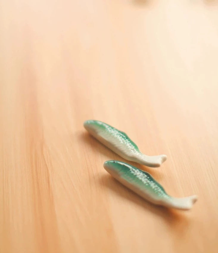 Zakka Chopstick Holder - Hand-painted porcelain fish in green and white ceramic. Perfect for hosting, intricate details, available as a single or pair. Small yet impactful dining accessory.