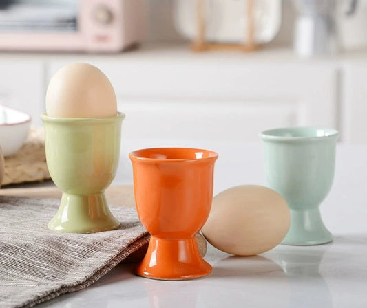 Stylish ceramic egg cup for drippy or hard-boiled eggs - vibrant colors, durable design. Perfect breakfast accessory.