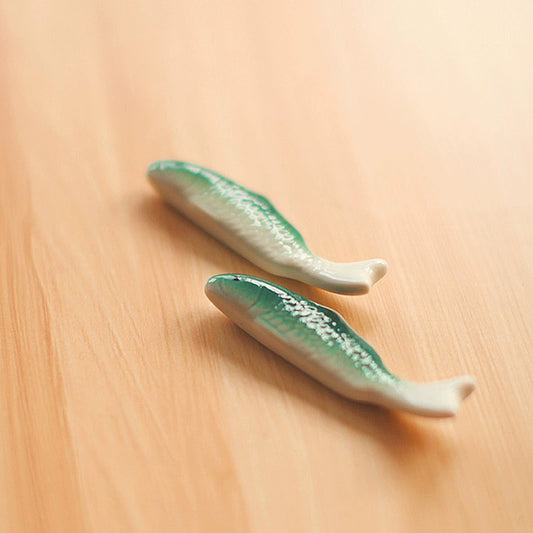 Zakka Chopstick Holder - Hand-painted porcelain fish in green and white ceramic. Perfect for hosting, intricate details, available as a single or pair. Small yet impactful dining accessory.