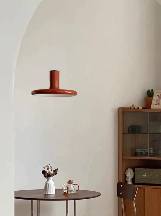 Dark red vintage pendant lamp with iron construction - the Nolan Pendant Lamp brings 1960s charm to your space. Elevate your décor with this unique lighting fixture.