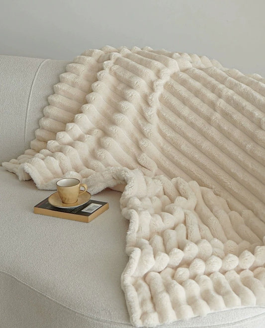 Veer Throw Blanket - Embrace ultimate comfort with this cozy double-sided blanket crafted from fuzzy coral velvet. Its minimalist design in neutral colors seamlessly blends with any decor. Available in three sizes for the perfect fit. Indulge in warmth and style with the Veer Blanket. 