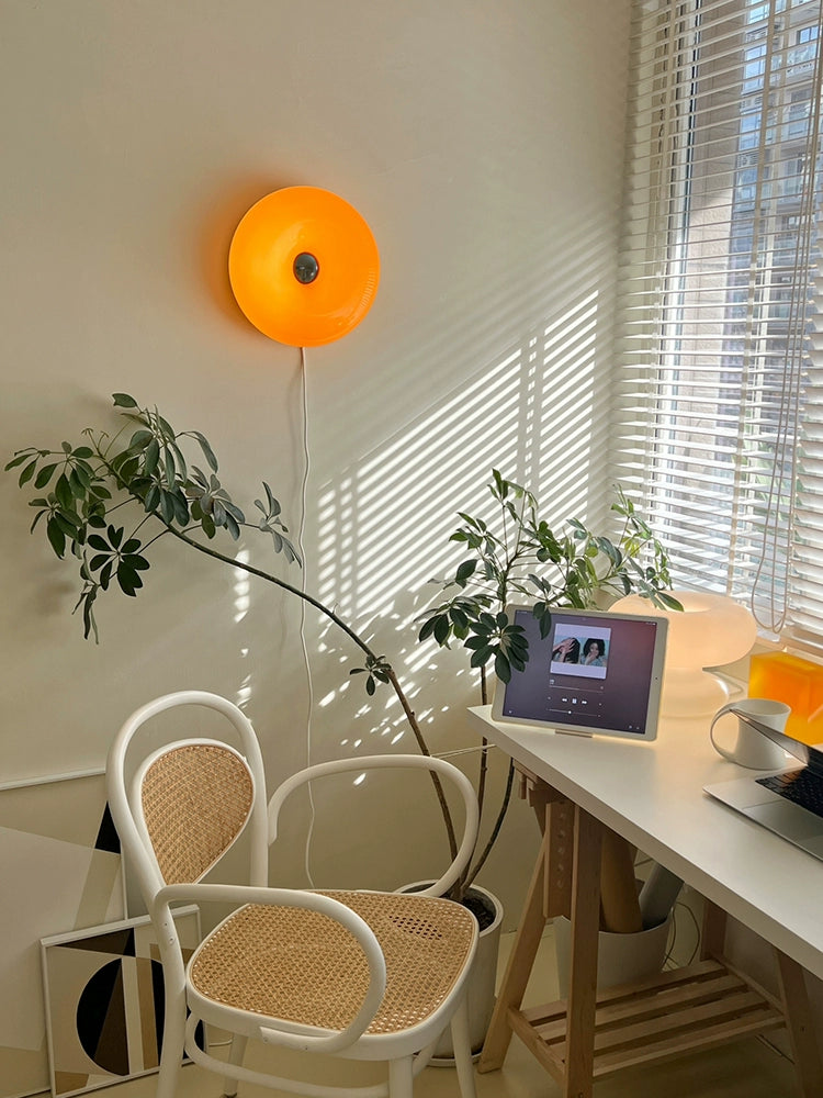 Orange or white doughnut-shaped Roman Lamp - a versatile modern masterpiece for table or wall placement. Glass design adds sophistication to contemporary decor. Illuminate your space with this chic statement piece.