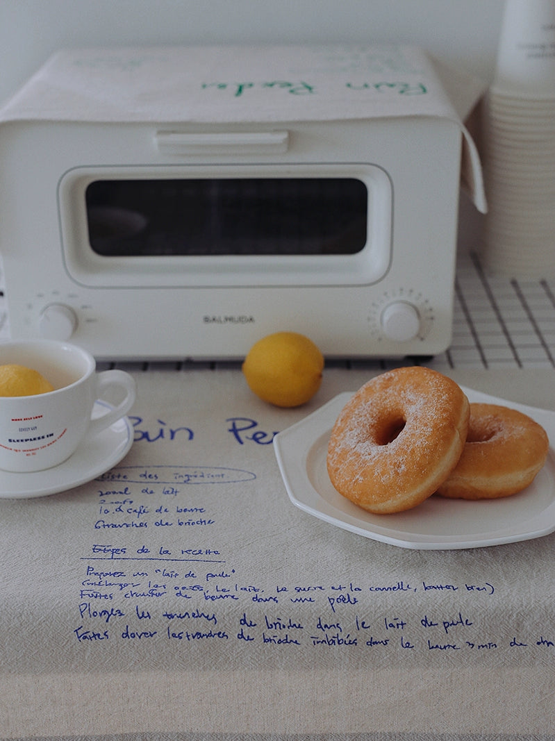 Pain Perdu Placemats - 40x50 cm cotton placemats with charming French text detailing a cute Pain Perdu recipe. Available in two colorways for delightful dining experiences.