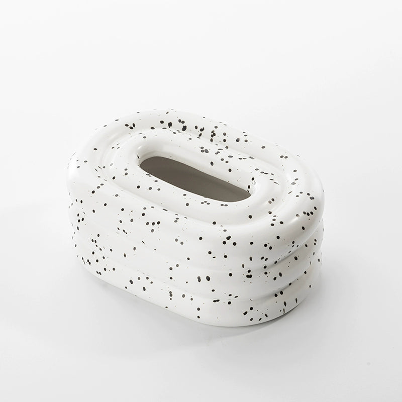  A modern ceramic tissue box cover with an oval shape, available in various stylish colorways. The cover adds a touch of contemporary elegance to home decor, seamlessly concealing tissue boxes while maintaining functional and chic design.