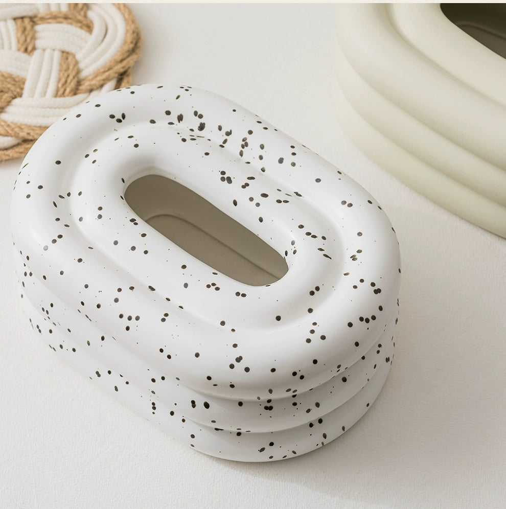  A modern ceramic tissue box cover with an oval shape, available in various stylish colorways. The cover adds a touch of contemporary elegance to home decor, seamlessly concealing tissue boxes while maintaining functional and chic design.