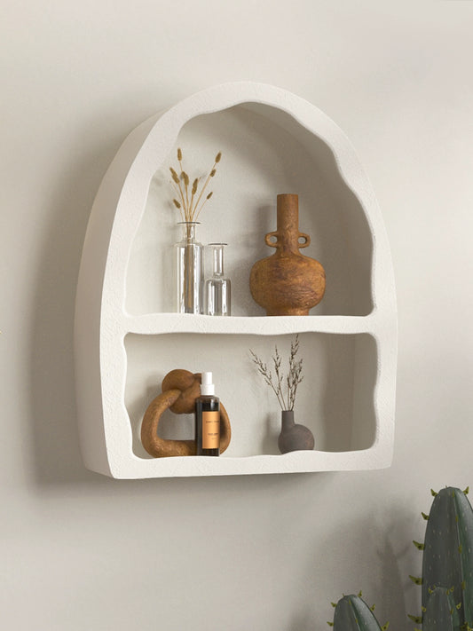 Bone white Odin Shelf, a two-level arched design for versatile storage. Hang on the wall or place on a surface, adding a cave-like ambiance with its unique organic shape. A stylish blend of form and function for your home décor.