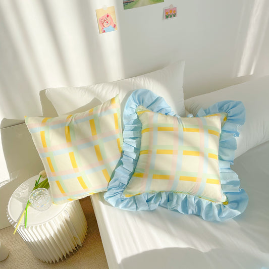 Vibrant cotton throw pillows with ruffle detail, available in solid or lattice prints