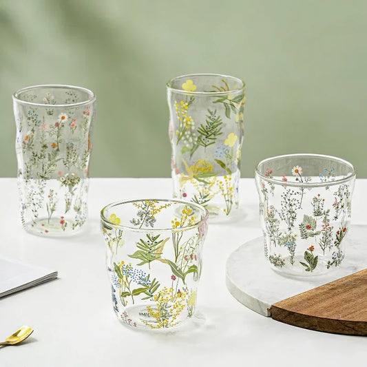 Lily Glass Collection: Flower printed glasses for juice, milk, and mixed drinks. Whimsical designs, various prints and sizes. Shop now.