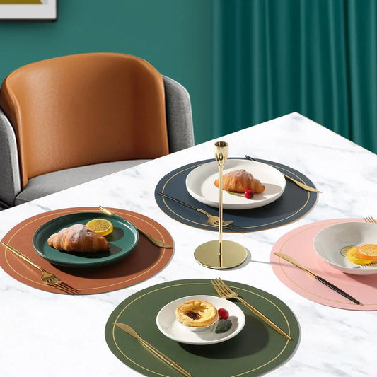 Round faux leather placemat with golden trim, oil-water-proof & heat-insulating features. Elevate your dining style!