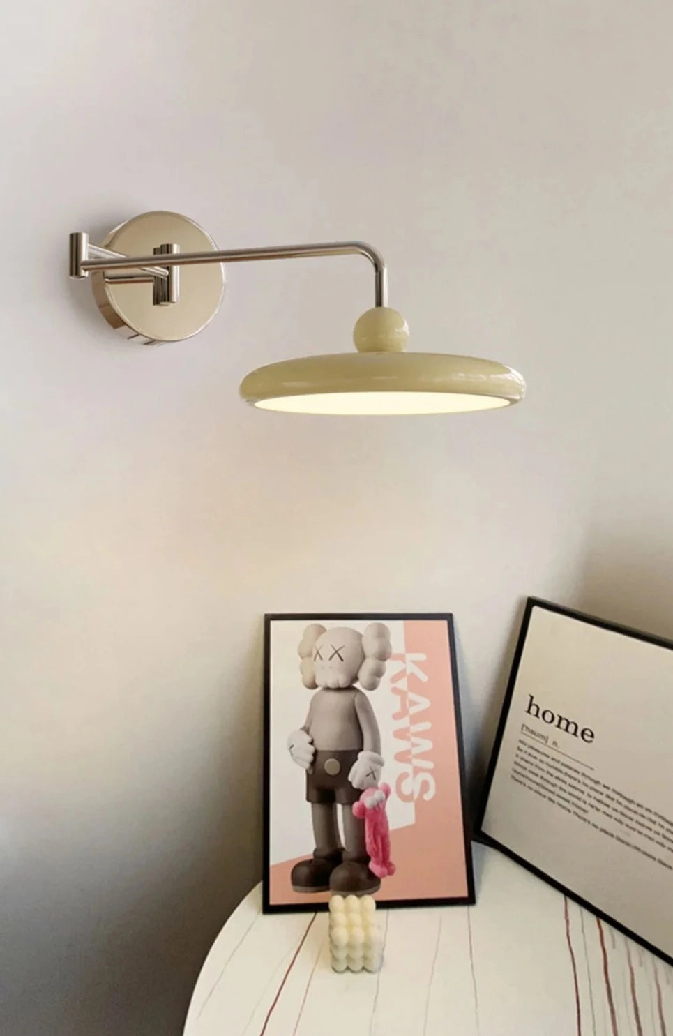 Modern Gogo Wall Lamp with silver and cream finish, ball detail, chrome accents, and swinging arm with knob switch. Ideal for cool homeowners, perfect for accent lighting in bedrooms, living rooms, or offices.