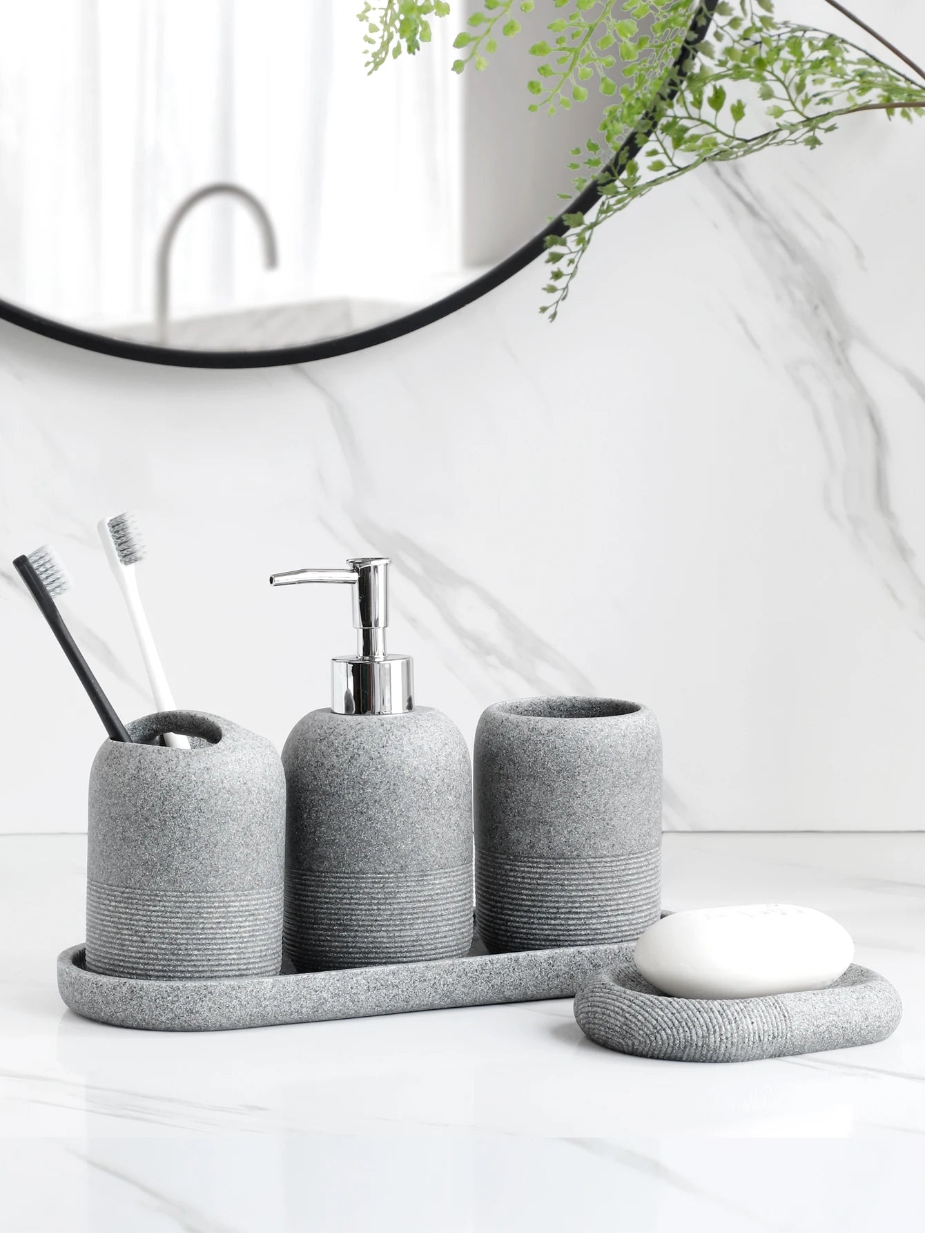 Inga Bath Set – five-piece resin bathroom set in neutral tones, including a tray, soap dish, dispenser, tumbler, and toothbrush holder for a chic, organized space.
