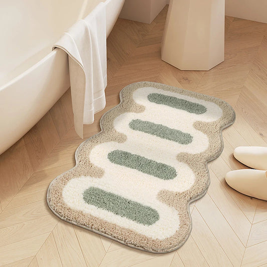 Stylish bath mat with scalloped edge, anti-slip pad, various colors.