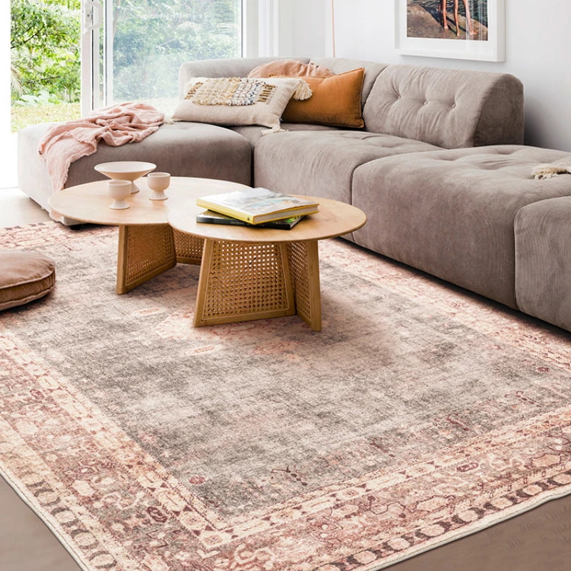 Zahava Rug – rectangular Persian-inspired rug with muted reds, grays, and multicolor accents, soft polyester material, and non-slip backing, available in various sizes.