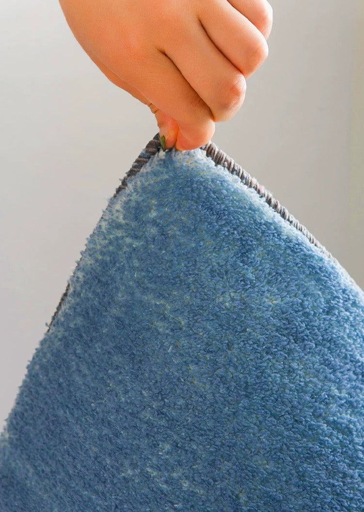 Cozy and absorbent Brooke bath mat with non-slip backing, scalloped edges, and terracotta polka dots. Shop now!